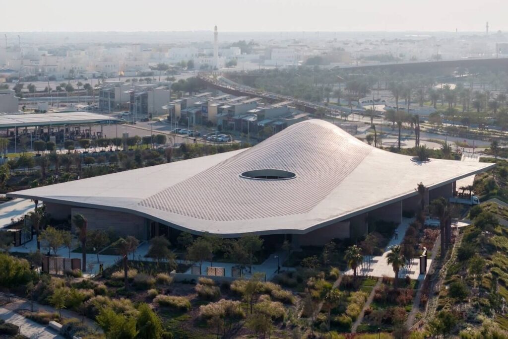 white sofa against a background of a black wall with molded white lighting