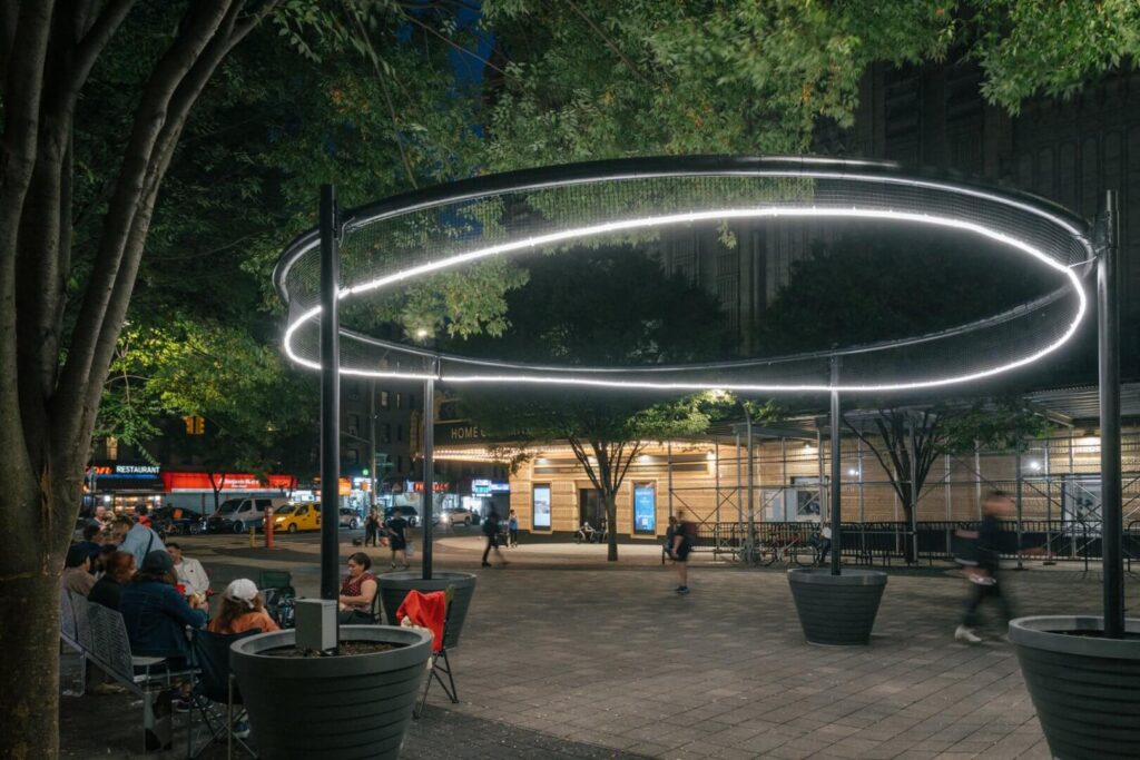 white sofa against a background of a black wall with molded white lighting
