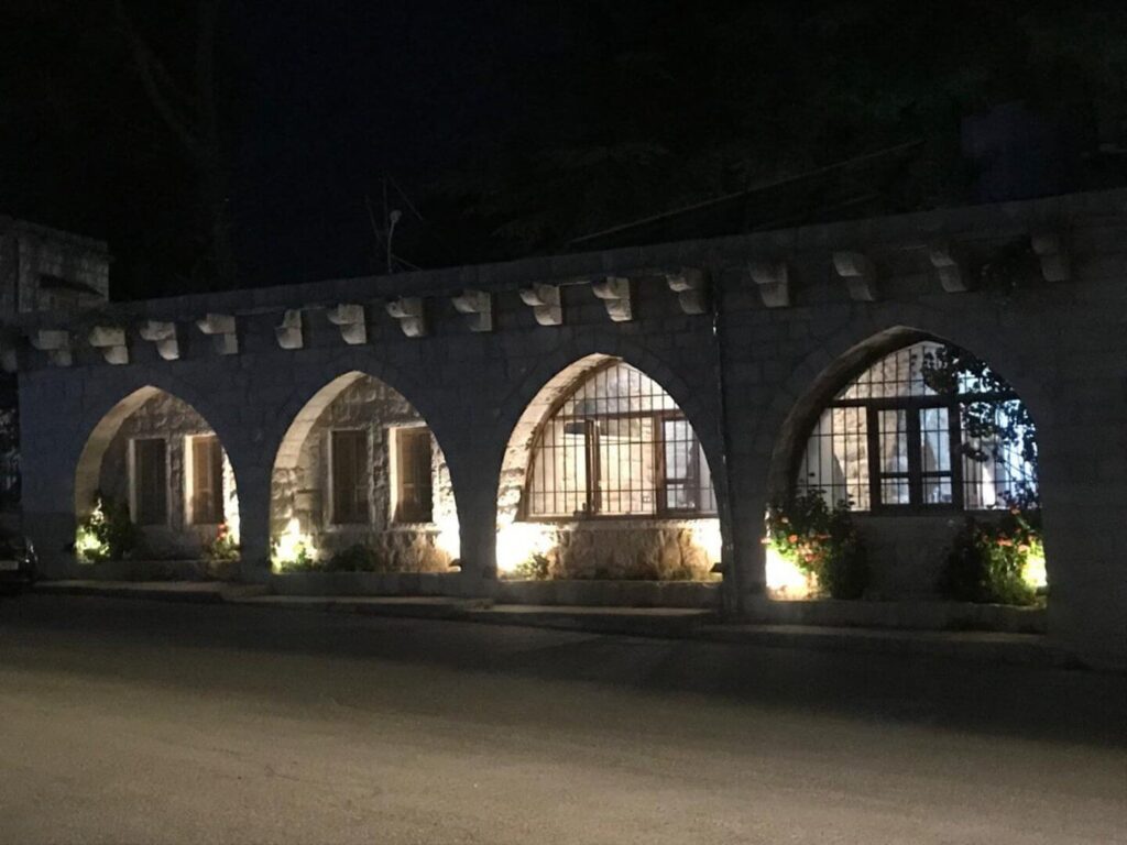 white sofa against a background of a black wall with molded white lighting