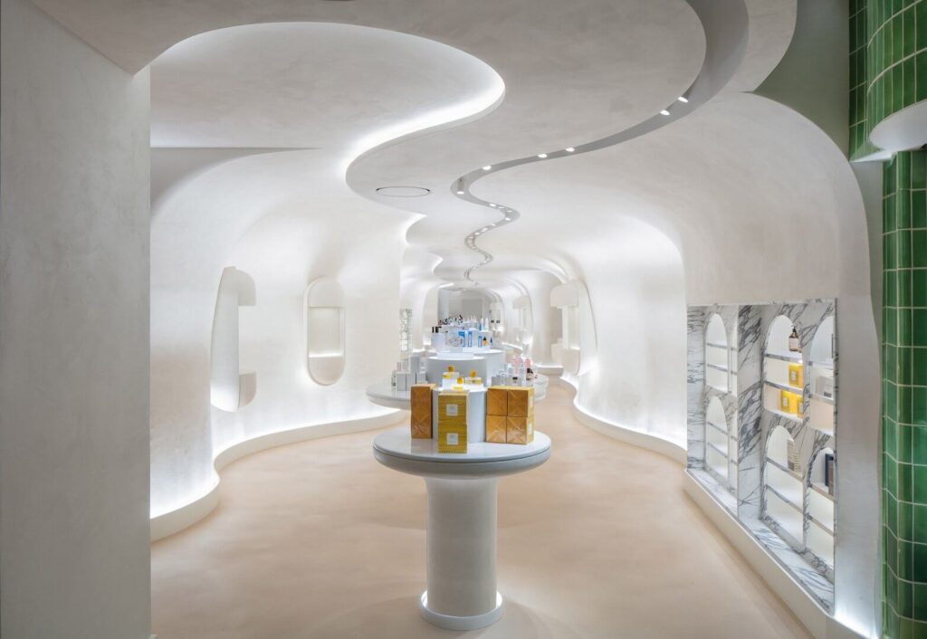 white sofa against a background of a black wall with molded white lighting