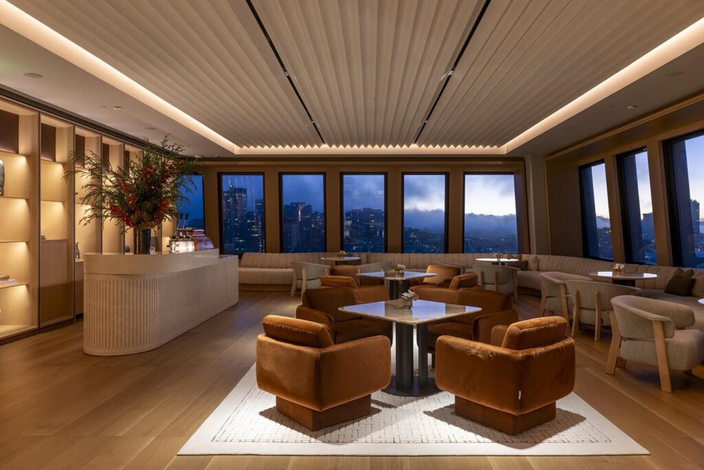 white sofa against a background of a black wall with molded white lighting