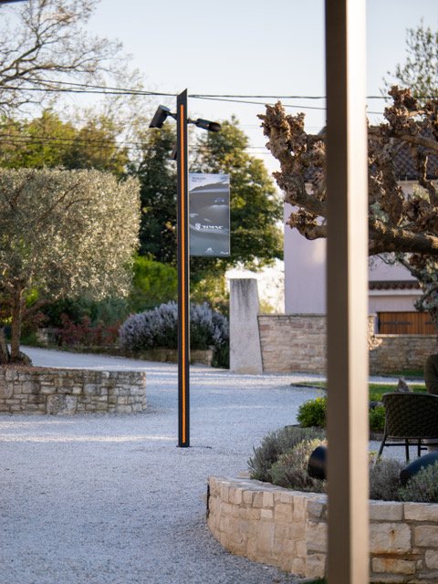 white sofa against a background of a black wall with molded white lighting